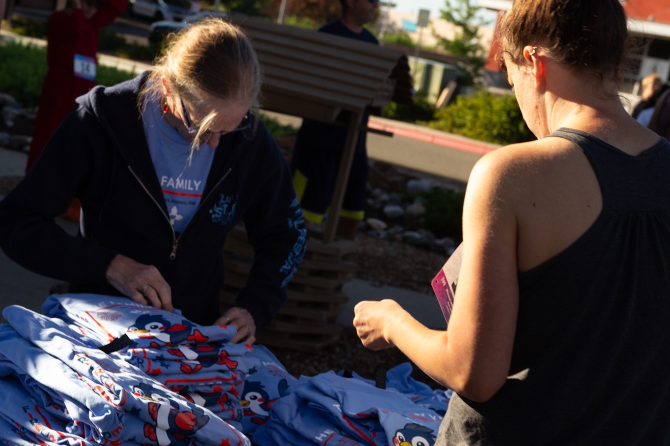 Volunteers working together at a YMCA community event