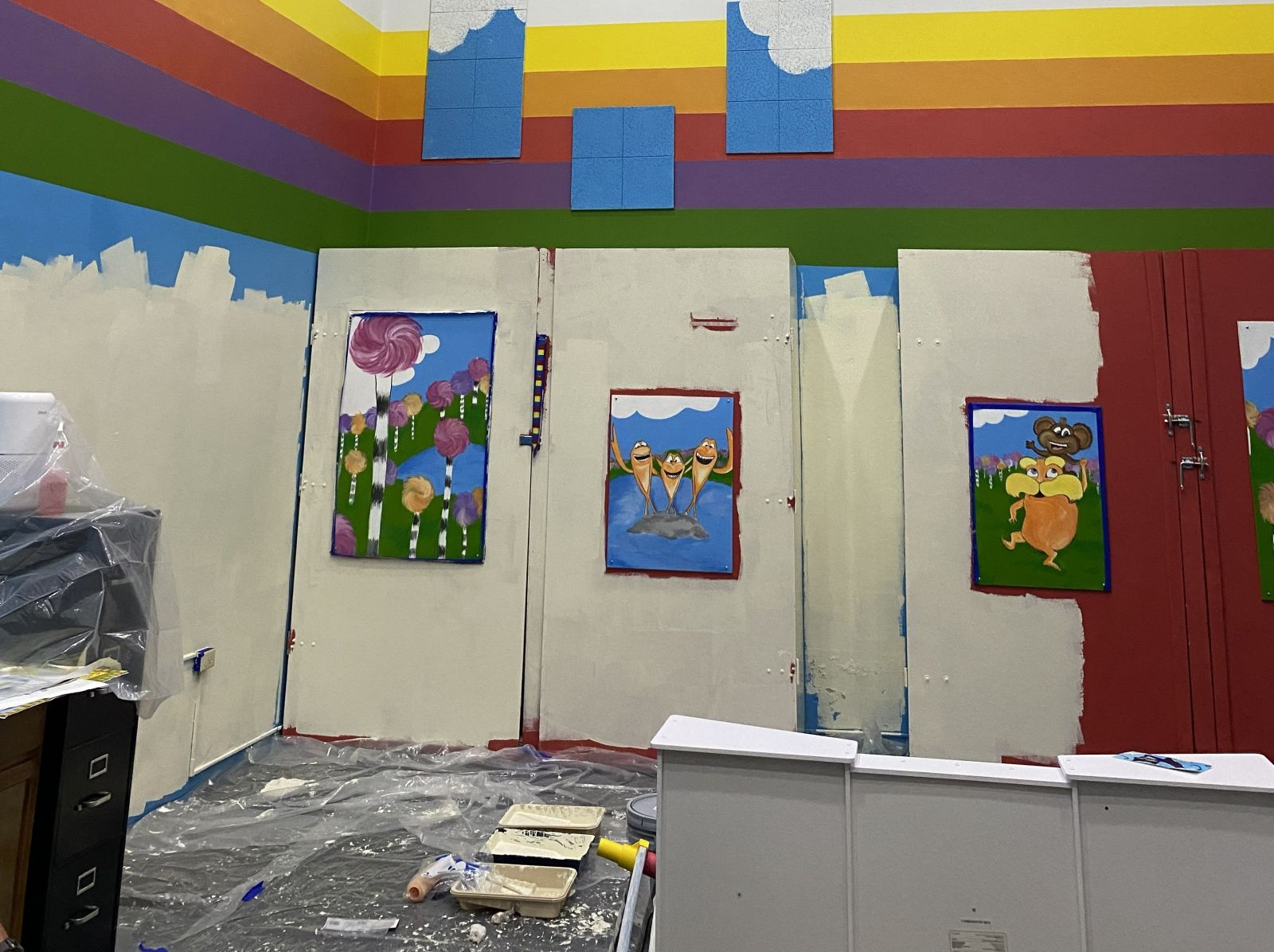 Volunteers painting and adding color to YMCA childwatch space