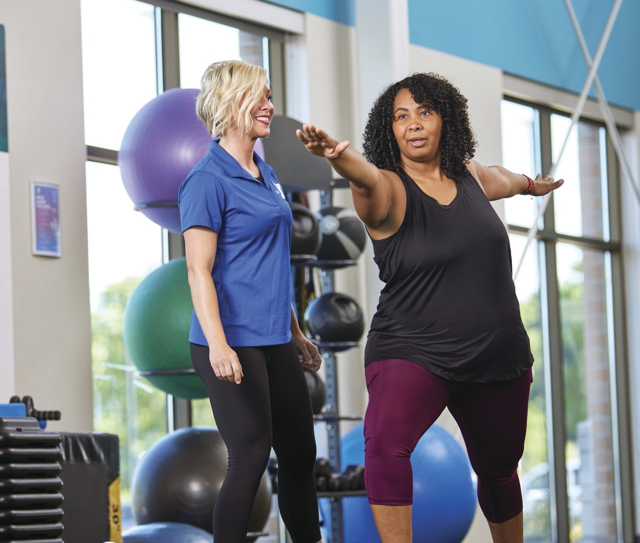 Parent working toward health goals in a gym